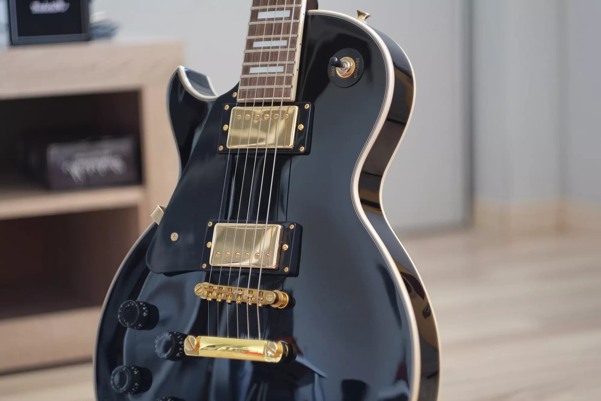 Black Gibson Les Paul Custom with gold hardware